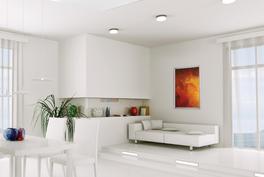 Salle de séjour avec panneau de plafond et tableau chauffant sur le mur